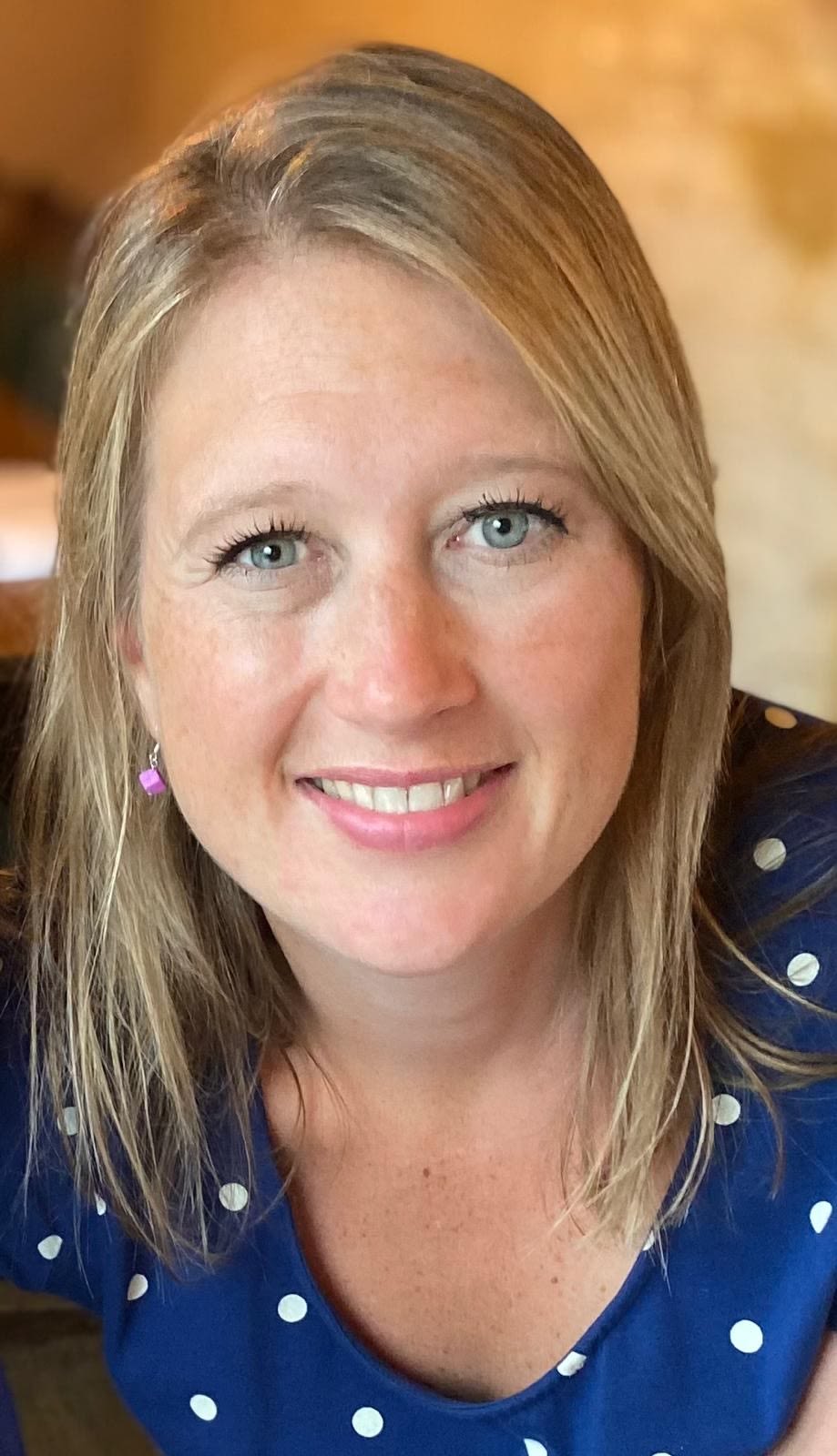 A man in a suit smiling 